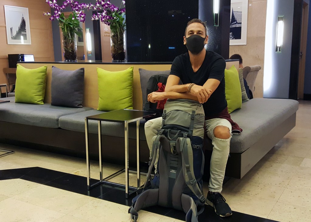 With backpack at Evergreen Hotel, Bangkok